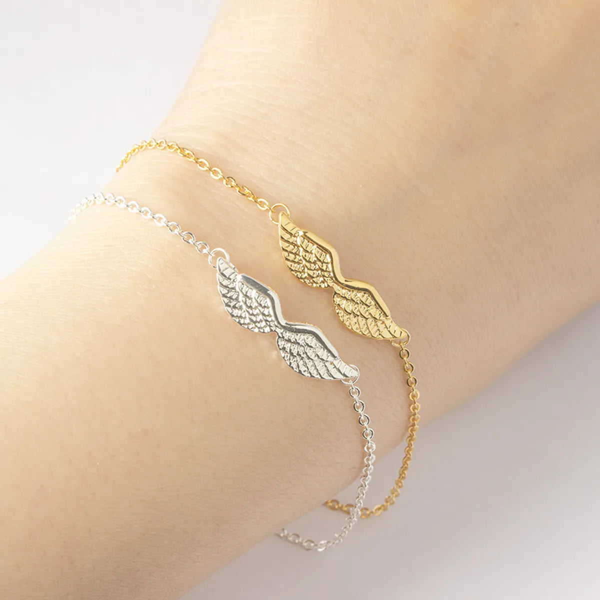 cultural bracelets for women -Simple Angel Wings Charm Stainless Steel  Bracelet Wholesale